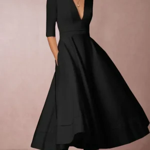 Robe midi élégante avec décolleté en V et jupe volumineuse pour un look élégant.